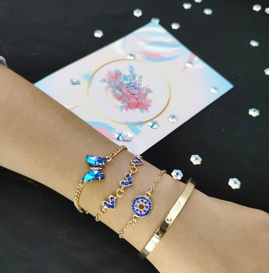 Set de pulseras doradas con cristales azul zafiro – Nia Vanity