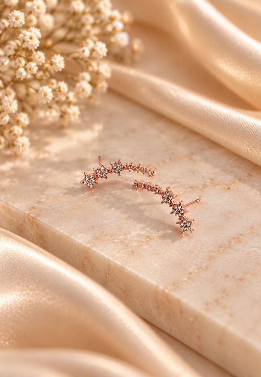 Pendientes estrella en color oro rosa de Nia-Vanity, con diseño brillante y elegante, ideales para complementar cualquier look.